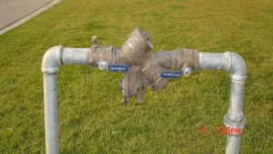 Reduced pressure backflow preventer must be at least 18" above ground. This prevents contaminated water from entering the water system.