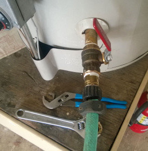 Attach garden hose to drain valve.