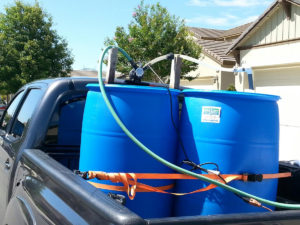 Two 55 gallon barrels in a Tacoma.