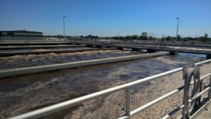 Giant mixers in an oxidation ditch aerate the water.