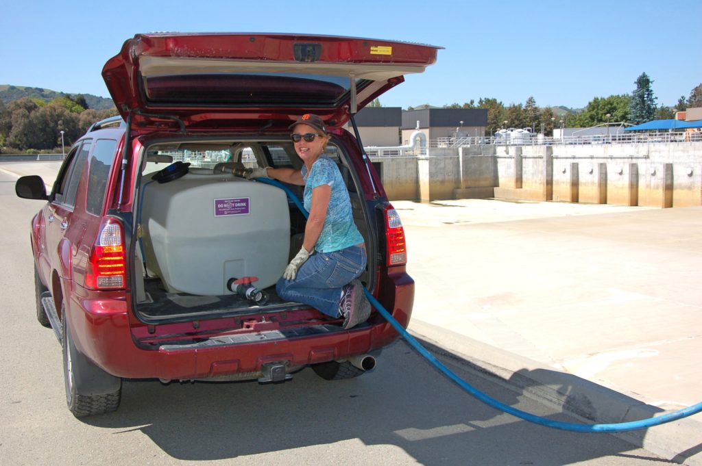 Rosalie Gallagher fills her recycled water tank. Credit: DSRSD.com